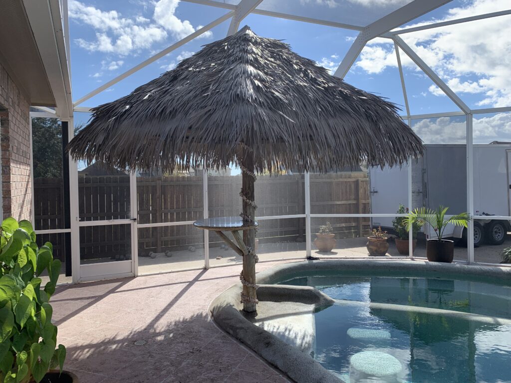 Exterior view of a screened pool enclosure on a Texas home