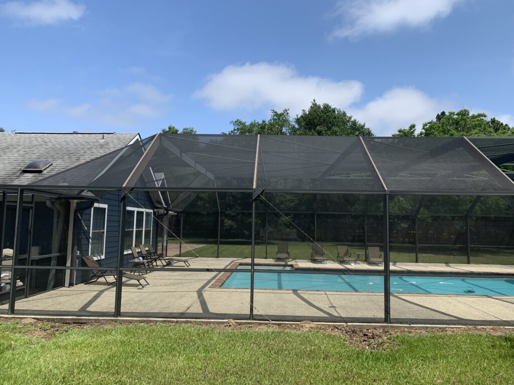 Close-up of the aluminum framing on a screened pool enclosure