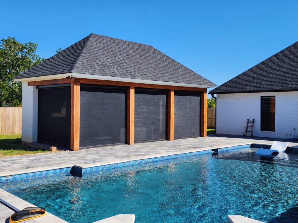 Motorized patio screen in a Houston, TX backyard by AOLE