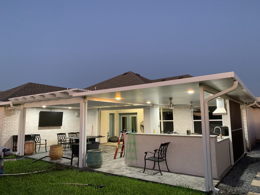 Covered outdoor kitchen and dining area in Cypress, TX