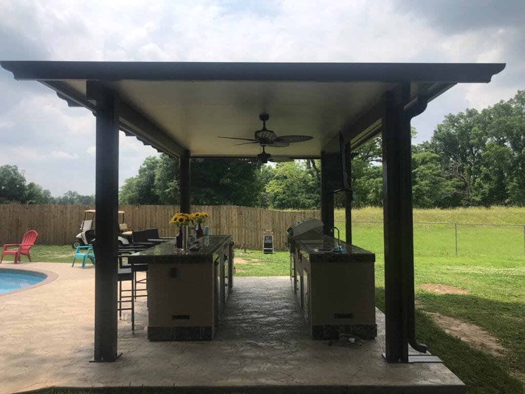 Custom outdoor kitchen and pergola in a Houston, TX outdoor living space